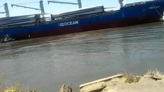 Tugboats escorts huge ship into port of Stockton