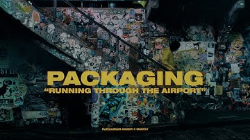 Packaging - Running Through the Airport (Official Video)