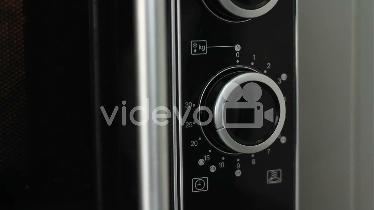 Setting microwave timer to twenty minutes and turning microwave off close angled shot YouTube