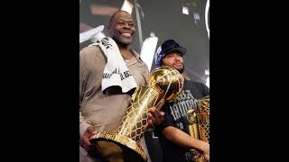Patrick Ewing holding the Larry O'Brien Championship Trophy