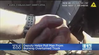 Deputy Helps Pull Man From Burning Overturned Truck