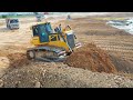 Bulldozer Pushing Dirt &amp; Dump trucks Unloading Soil Clearing Mud