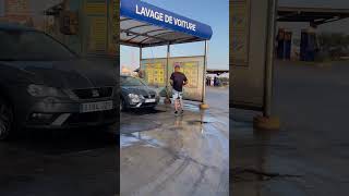 Guy Falls Trying to Chase Another With a Car’s Water Spray