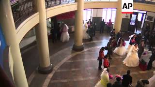 Couples gather to tie the knot in chilly mass wedding