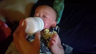 Lana Holding Her Bottle Independently.