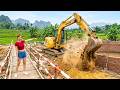 Crane Lifts Giant Bamboo Poles Building A Bamboo Bridge To The Island In The Fish Pond
