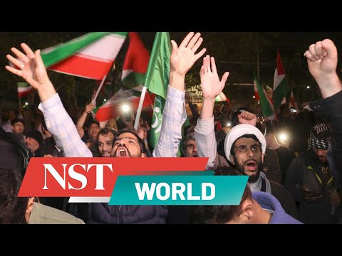 Iranians celebrate attack against Israel, launching fireworks and waving flares