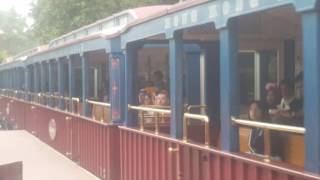 Hong kong disneyland railroad train ride arriving.