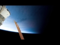 Shuttle Discovery and ISS go from night to day, with aurora