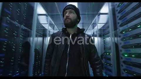 Two Hackers Walking Through Rows of Servers | Stock Footage - Envato elements