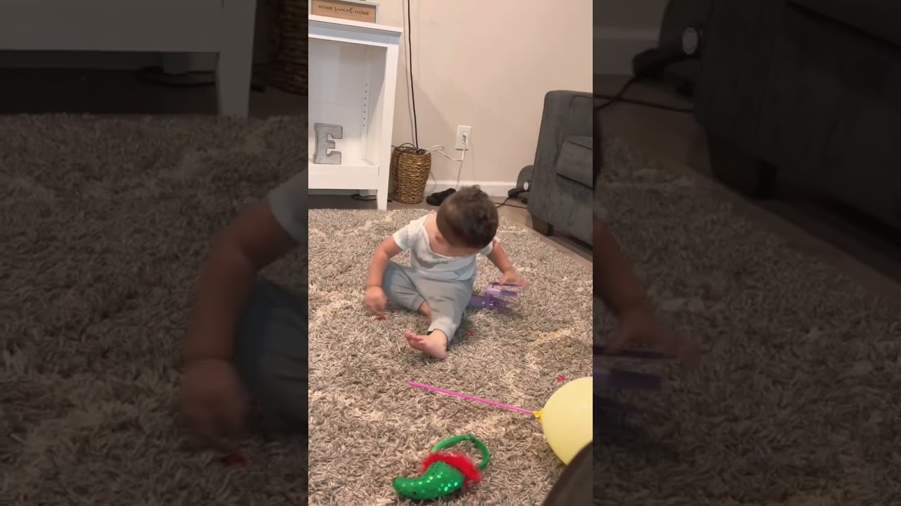 Baby gets frustrated trying to sit on you chair 