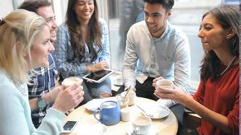 Group Of Friends In Cafe Using Digital Tablet 1 | Stock Footage - Videohive