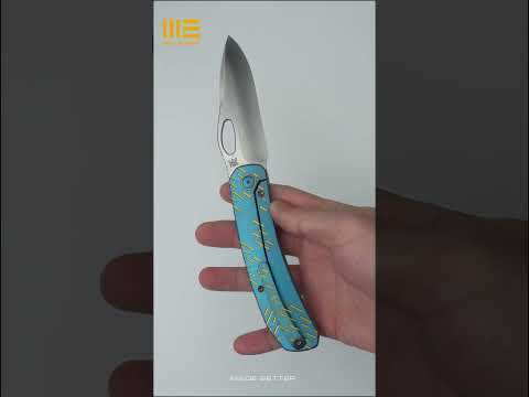 The WE Inmate with blue titanium handle with golden raindrop texturing and a satin CPM-20CV blade.
