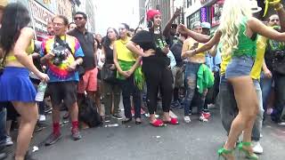 BRAZILIAN GIRLS DANCERS DANCE SAMBA AT BRAZILIAN PARADE CARNIVAL STREET PARTY