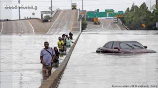 Harvey floodwaters overflow Houston reservoir, separate levee breach reported