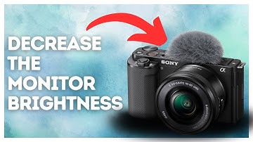 How to decrease the monitor brightness on Sony ZV-E10?