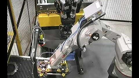 Motoman UP20 loads and unloads a drill machine