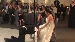 Guy Sitting on Friend's Shoulders Falls on Face Trying to Catch Garter at Wedding - 1102422
