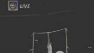 Horizontal bar.swing fwd to 1 arm + 360
