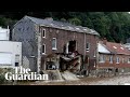 Belgian news crew capture moment flooded house partially collapses