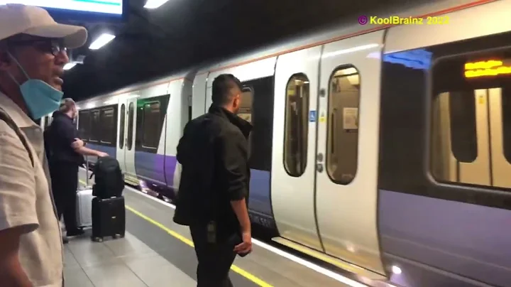 An Elizabeth Line Train arrives at Heathrow Terminals 2 & 3, London, UK