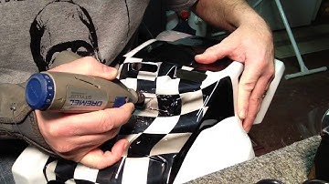 Cutting holes in a ProLine FloTek body with a dremel.