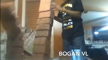 Kid destroys glass table with bricks