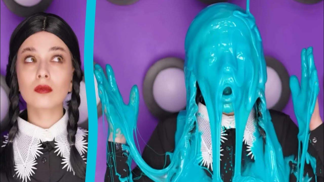 CC5 - Wednesday Adams blue slimed - Wednesday Adams sitting in a mystery buttons box getting gunged with bright blue slime.