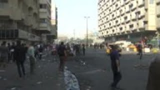 Anti-riot police fire tear gas at Baghdad protesters