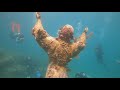 Fl keys  christ of the abyss statue with rainbow reef scuba dive