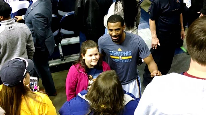 Kari gets her picture with Mike Conley of the Memp...