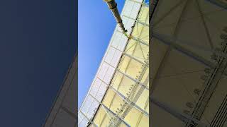 ADVERTISING BOARD, FLOODLIGHTS AND SHINING CANOPY ABOVE THE ROOF TOP...