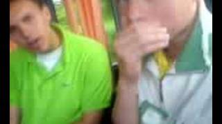 boys on bak of bus MCing