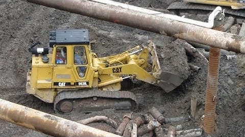 Cat 963B Track Loader Digging Mud