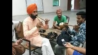 Punjabi folk instruments are being played by folklorist