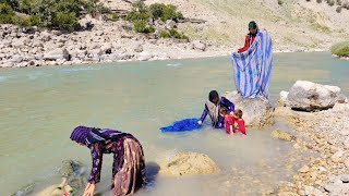 Nomads of Iran. Washing clothes by the river
