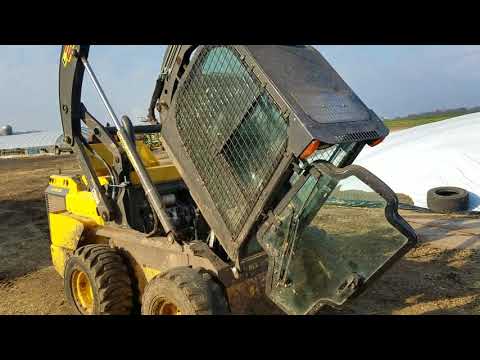 How to lift the cab on the l230 skid loader New Holland