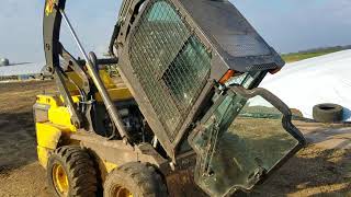 How to lift the cab on the l230 skid loader New Holland
