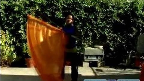 Color Guard Moves & Techniques : How to Do a Drop Spin with a Color Guard Flag