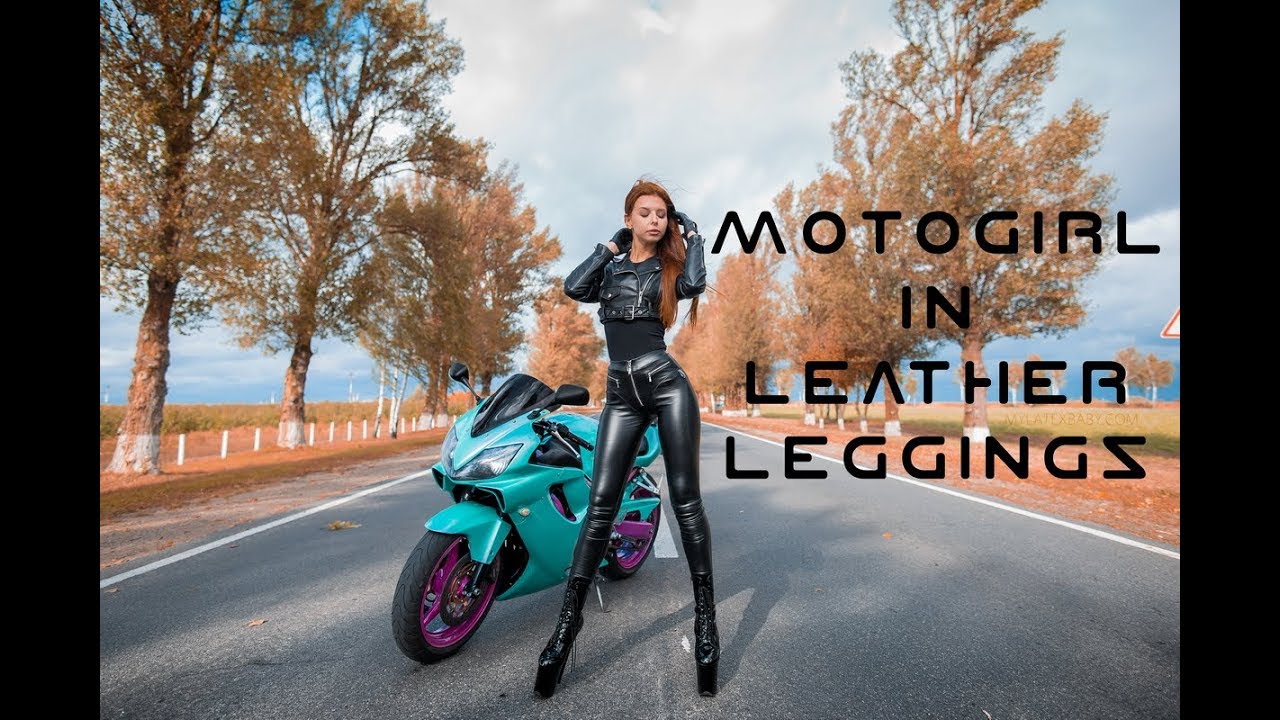 SEXY RED-HAIRED MOTOGIRL IN LEATHER LEGGINGS 