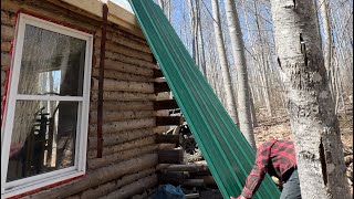 Putting a metal roof at the log cabin,need a ladder on the roof.Falling down the Roof?Family around