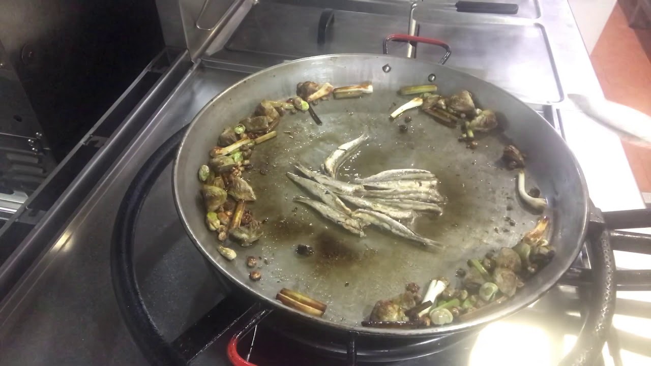 Arroz con Alcachofas de La Vega Baja , ajos tiernos y boquerones