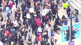 A large group of protesters are outside San Francisco City Hall