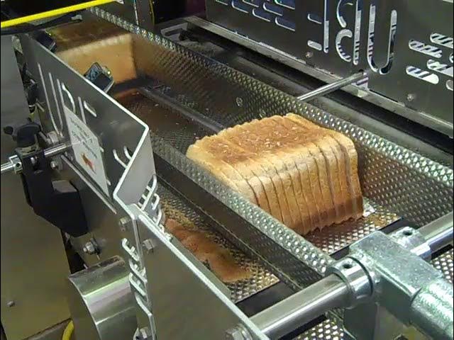 Bread slicer machine in food and bekery production line Stock