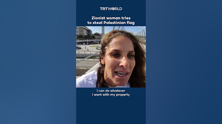 Zionist woman attempts to steal Palestinian flag from protesters