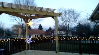 This elevated wood deck features a corner pergola so the home owner can enjoy some shade on warm sunny days. This deck and 