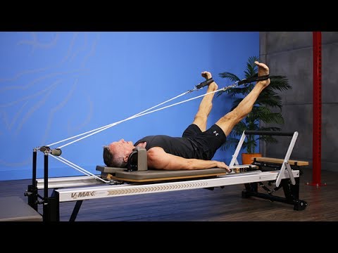 Feet in Straps - X Bend and Stretch on Pilates Reformer 