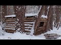 Building a warm winter shelter for survival in the wild woods winter bushcraft asmr