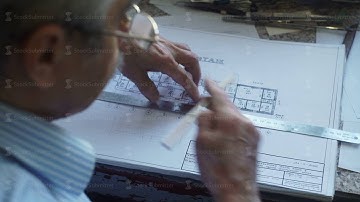 Architect applies to the drawing line and draws a line in pencil