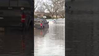 Vehicles submerged after flooding in Dearborn Heights